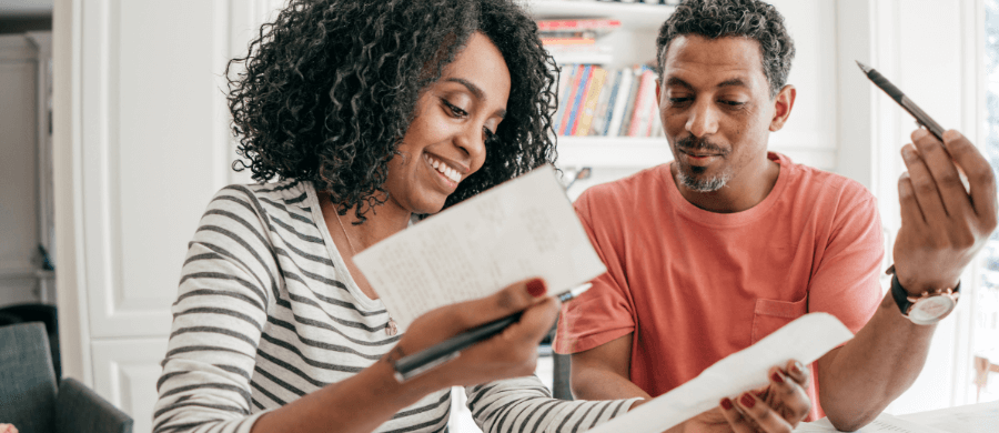 Older couple reviewing receipts together