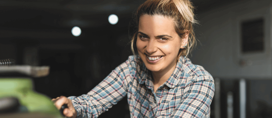 Smiling woman in checkered shirt