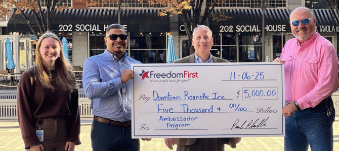 Freedom First employees presenting $5,000 check to Downtown Roanoke Inc