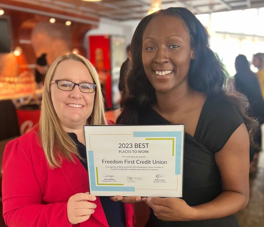 Freedom First employees holding 2023 Best Place to Work award