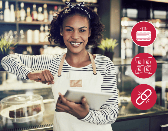 Bakery owner holding tablet with payment option icons to her left
