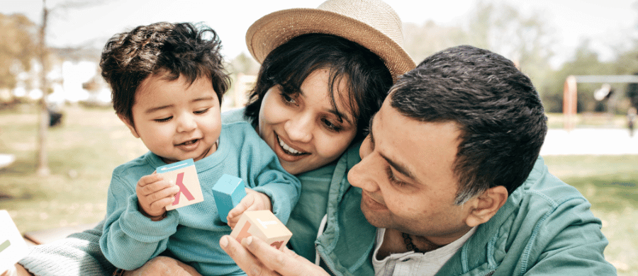 Young parents with a toddler on a picnic