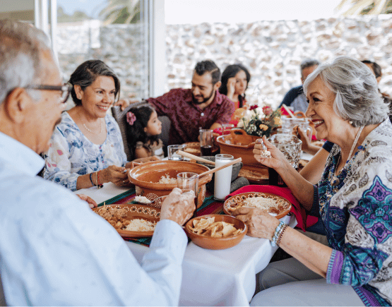 Vibrant multi-generational family enjoying dinner together