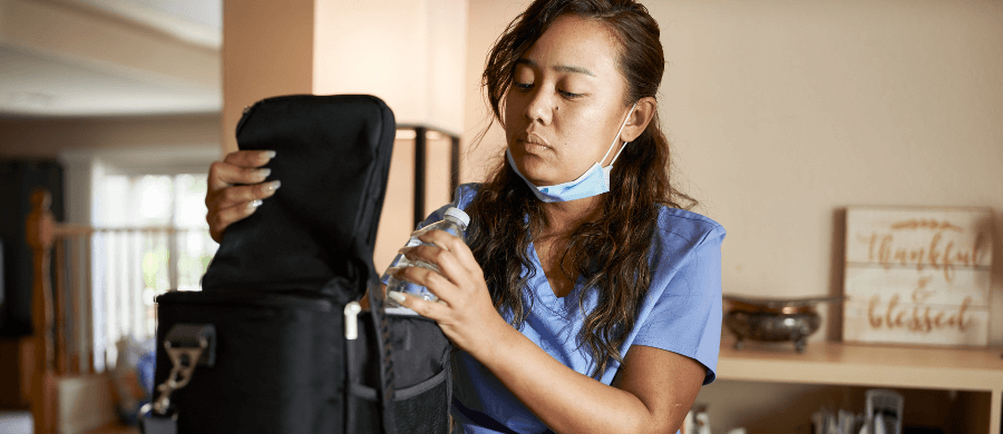 Nurse packing her lunch box at home