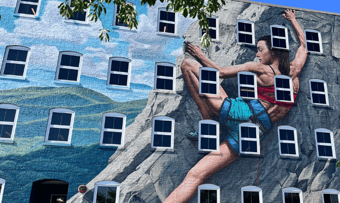 Freedom First's Elmwood headquarters mural of a woman climber