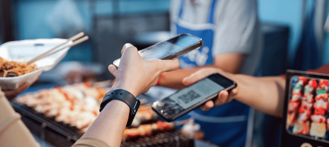 Phone-to-phone payment using a QR code at a food stall