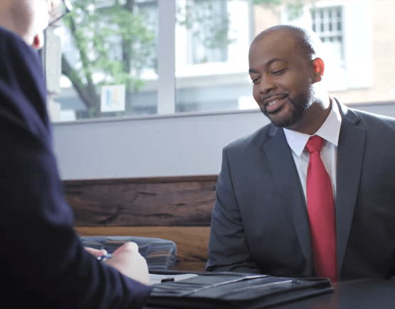 Professional young man meeting with a Freedom First banker