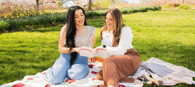 Financial Empowerment Center counselors reading a book in Elmwood park
