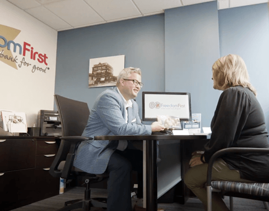 Jeremiah Clarke meeting with a client at his office